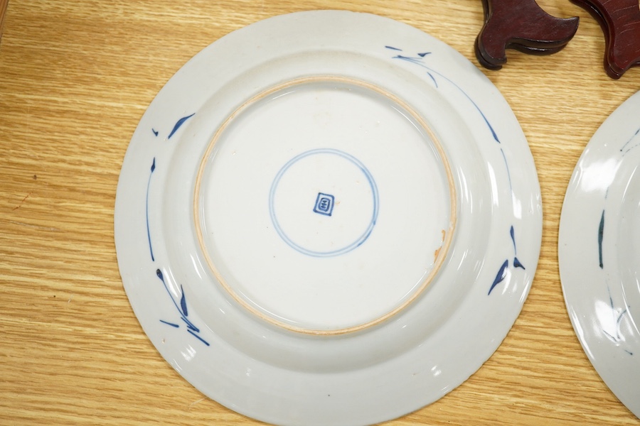 A near pair of 18th century Chinese blue and white 'basket' plates, ring marks to the bases, 20cm in diameter. Condition - good, minor chipping